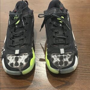 Jordan Black and Green Athletic Shoes with Reflective Accents